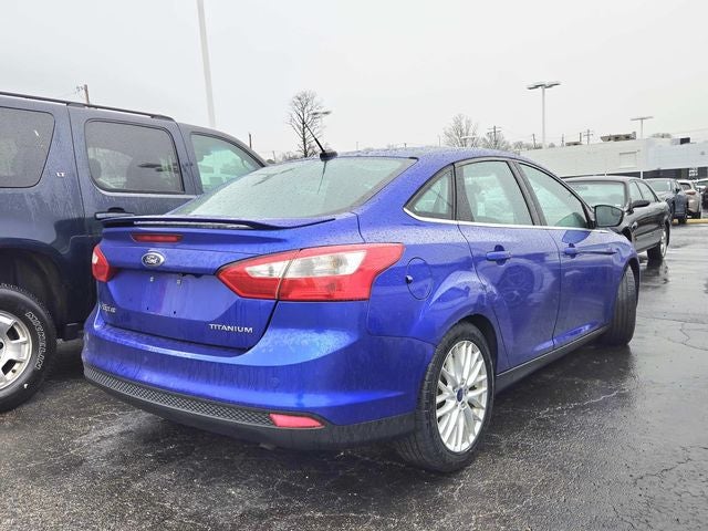 Used 2014 Ford Focus Titanium with VIN 1FADP3J23EL307754 for sale in St. Louis, MO